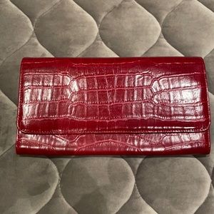 Unlabeled embossed red clutch